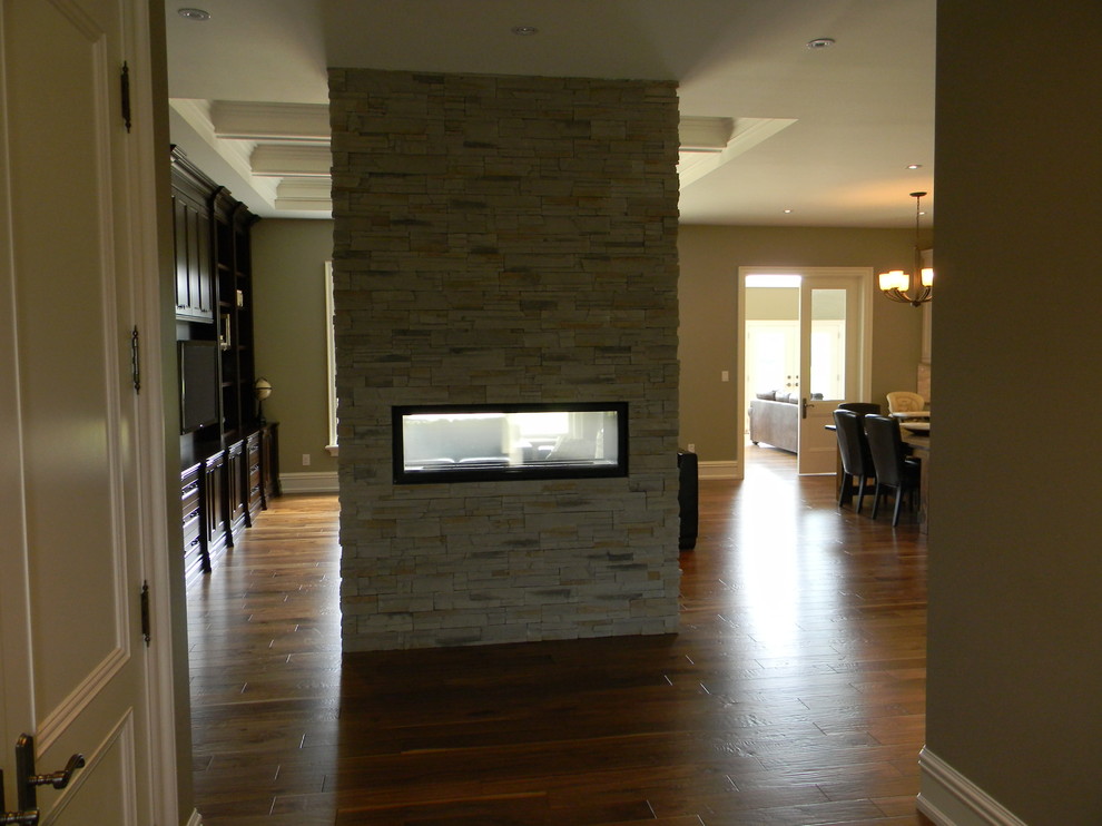 Double Sided Gas Fireplace in Bungalow Entry Toronto by Rijus
