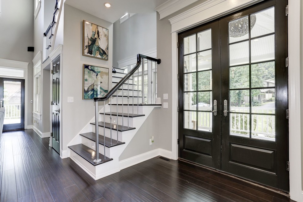 Mid-sized transitional dark wood floor and brown floor entryway photo in Baltimore with gray walls and a glass front door