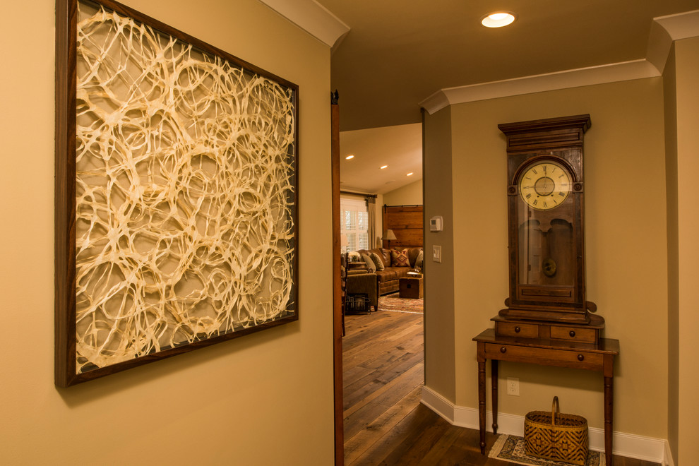 Design ideas for a classic foyer in Raleigh with beige walls, medium hardwood flooring and brown floors.