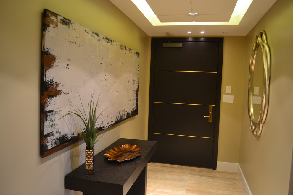 This is an example of a small modern foyer in Vancouver with ceramic flooring.