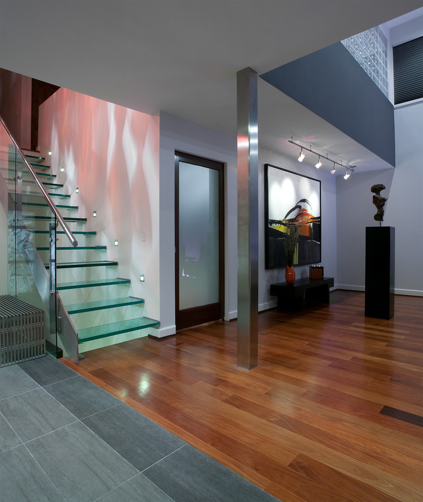Inspiration for a contemporary entryway remodel in Kansas City with white walls