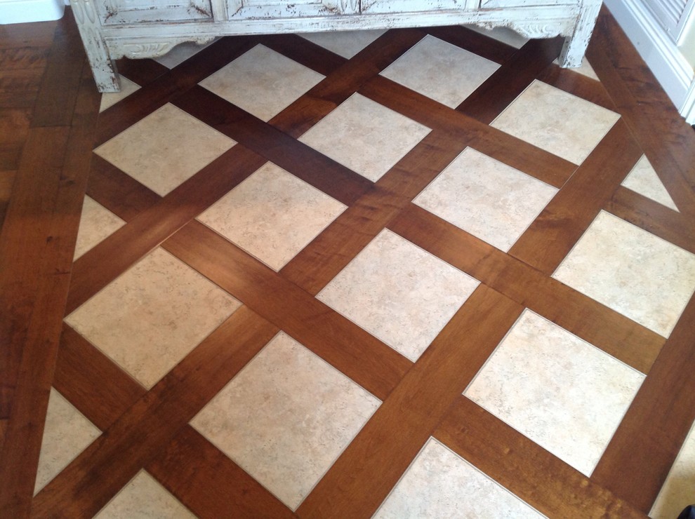 Inspiration for a mid-sized transitional medium tone wood floor foyer remodel in San Diego
