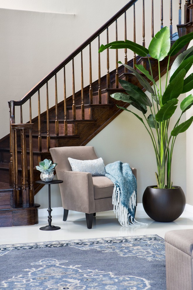 Mid-sized minimalist white floor foyer photo in Los Angeles with beige walls