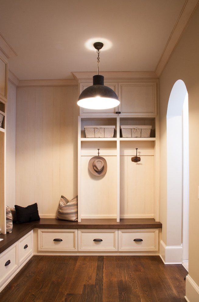 Example of a mid-sized classic dark wood floor mudroom design in Atlanta with white walls