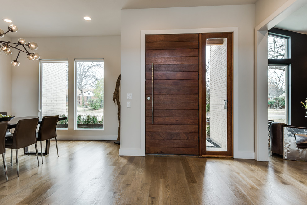Design ideas for a medium sized modern front door in Dallas with white walls, light hardwood flooring, a single front door and a brown front door.