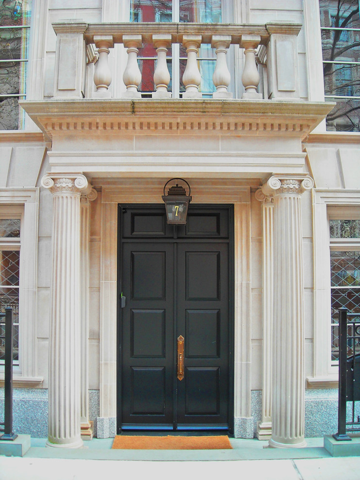Photo of a medium sized victorian front door in New York with a double front door and a black front door.