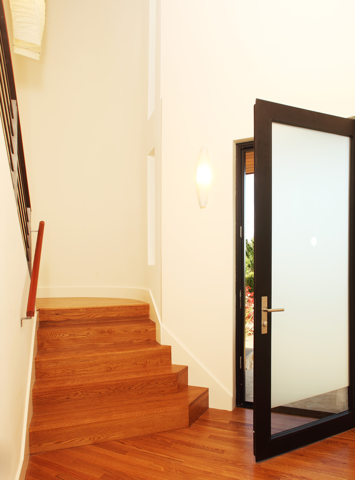 Medium sized modern vestibule in San Francisco with a single front door and a glass front door.