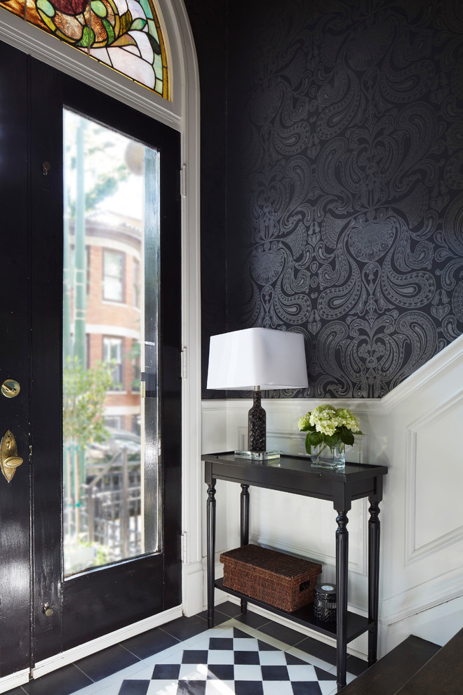 Design ideas for a traditional foyer in Chicago with black walls, a single front door, a glass front door, multi-coloured floors and feature lighting.