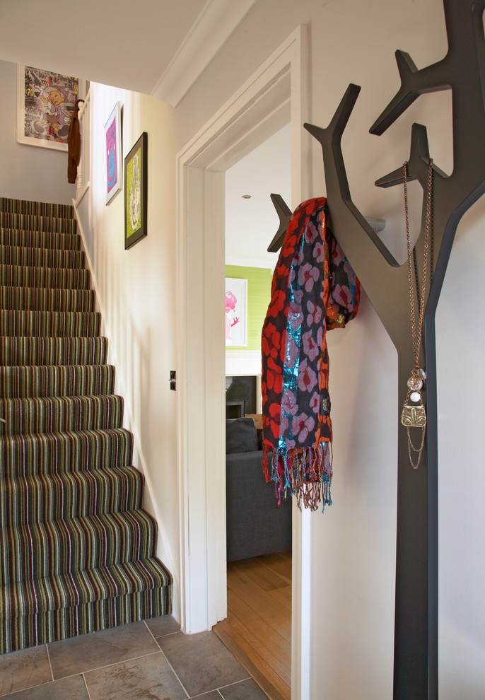 Entryway - eclectic entryway idea in Dublin with gray walls