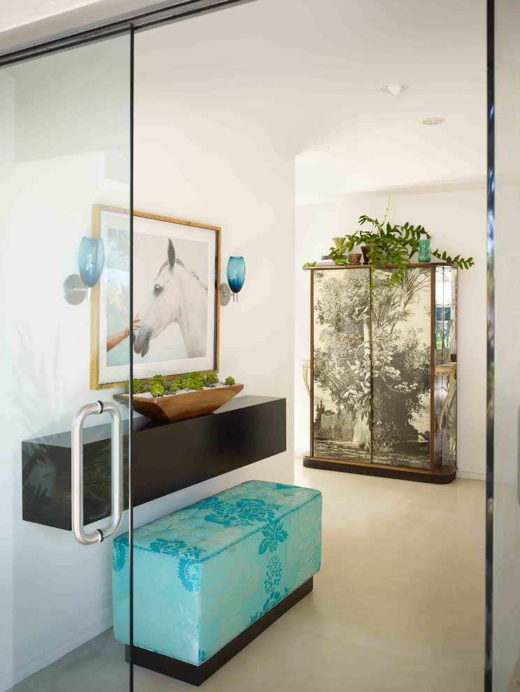 Photo of a contemporary hallway in Orange County with white walls, a double front door and a glass front door.