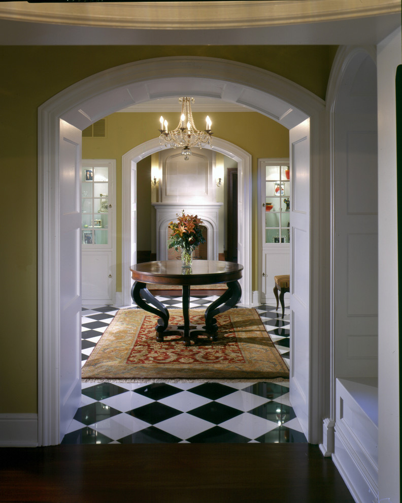 Inspiration for a medium sized classic vestibule in New York with yellow walls and marble flooring.
