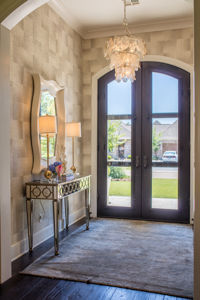 Design ideas for a medium sized classic front door in New Orleans with beige walls, dark hardwood flooring, a double front door, a glass front door, brown floors and feature lighting.