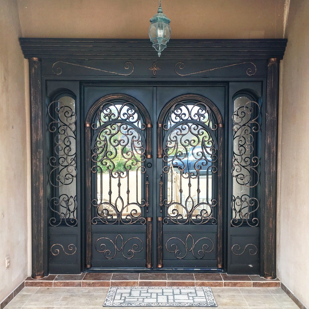 Example of a large mountain style entryway design in Dallas with beige walls and a black front door
