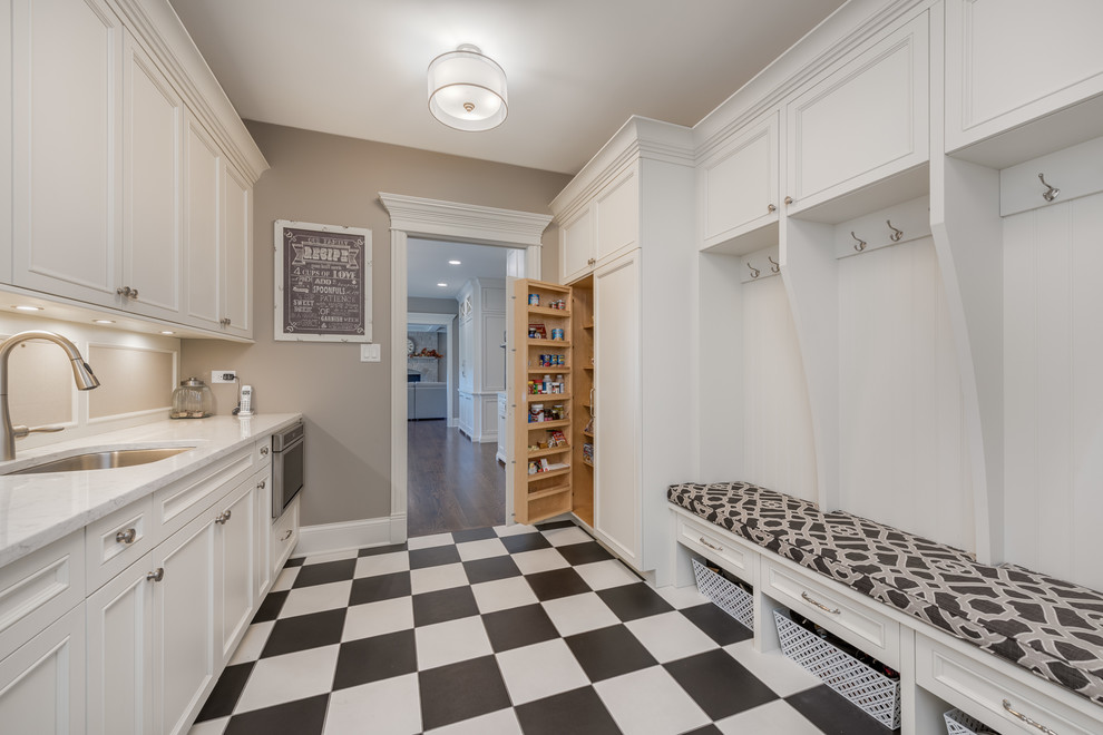 Mid-sized cottage porcelain tile and multicolored floor mudroom photo in Chicago with gray walls