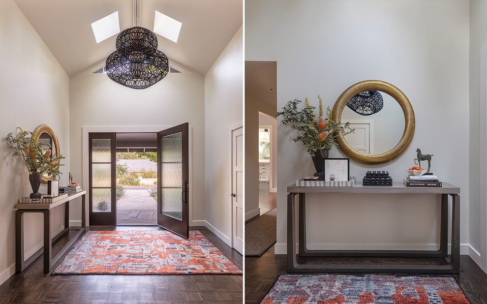 Large modern foyer in San Francisco with white walls, dark hardwood flooring, a single front door, a glass front door and brown floors.