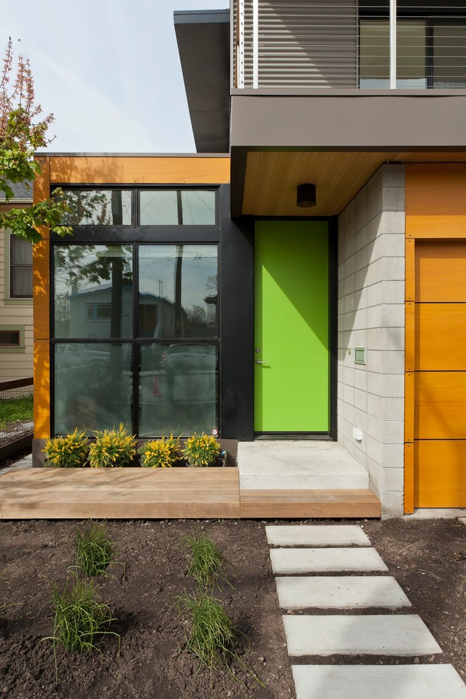 Example of a trendy single front door design in San Francisco with a green front door