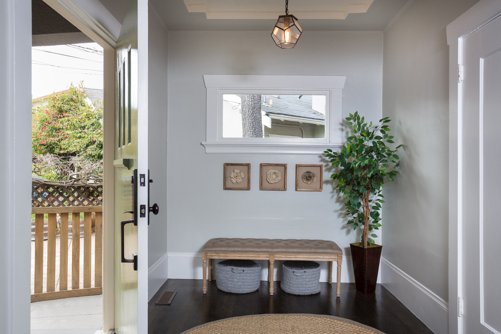 Entryway - mid-sized contemporary dark wood floor entryway idea in San Francisco with gray walls and a green front door