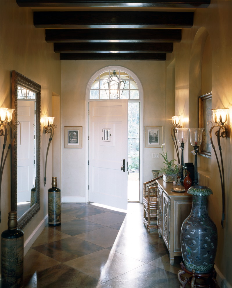 Photo of a traditional entrance in Other with concrete flooring.