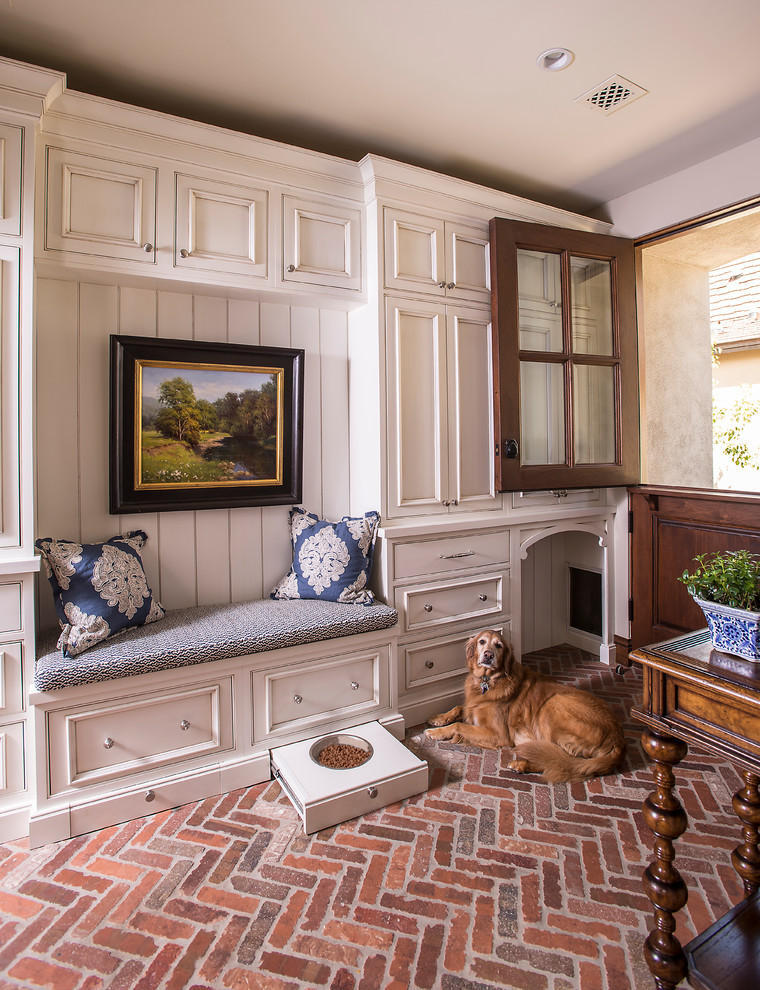 Inspiration for a timeless brick floor entryway remodel in Phoenix with a dark wood front door