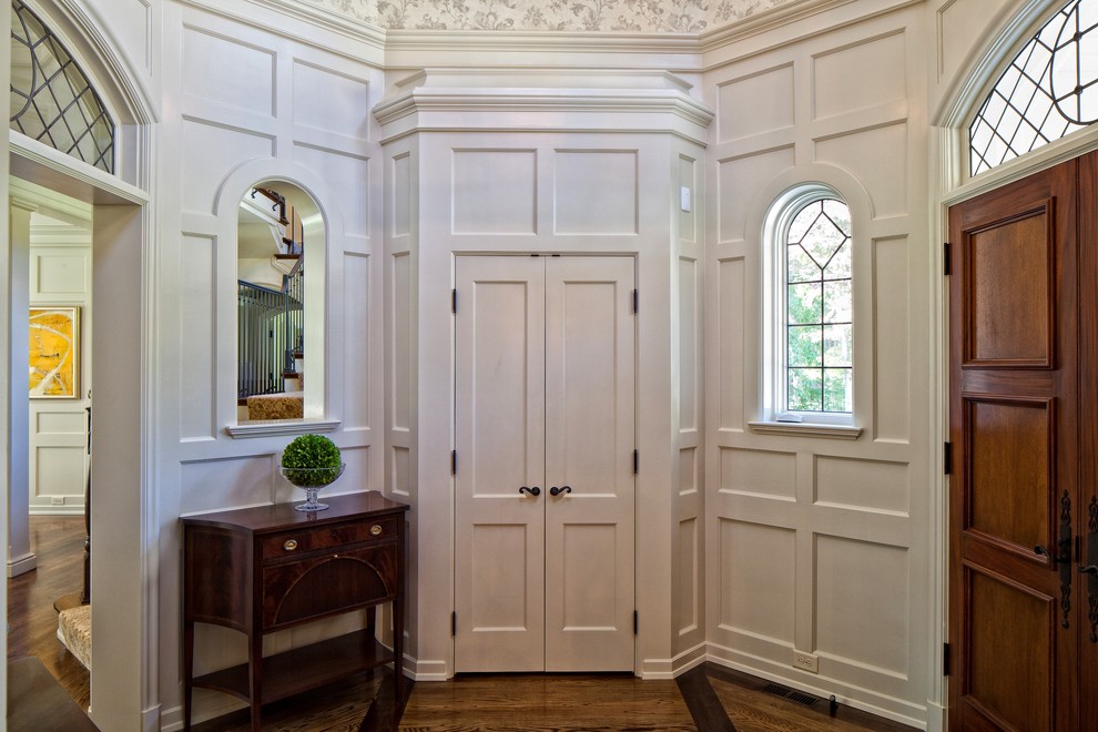Inspiration for a traditional entrance in Raleigh with white walls.