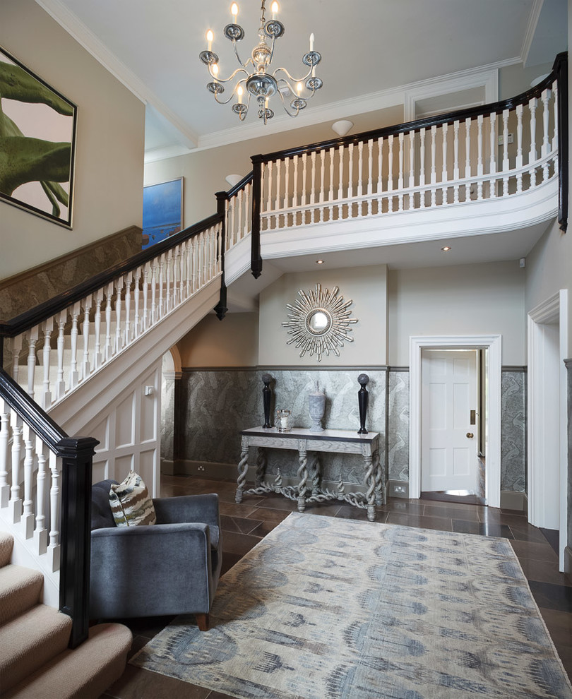 This is an example of a large eclectic hallway in Cambridgeshire with limestone flooring.