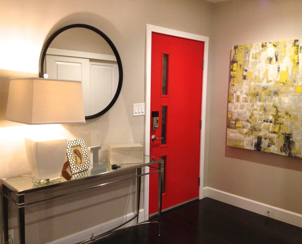 Inspiration for a small modern dark wood floor entryway remodel in Los Angeles with beige walls and a red front door