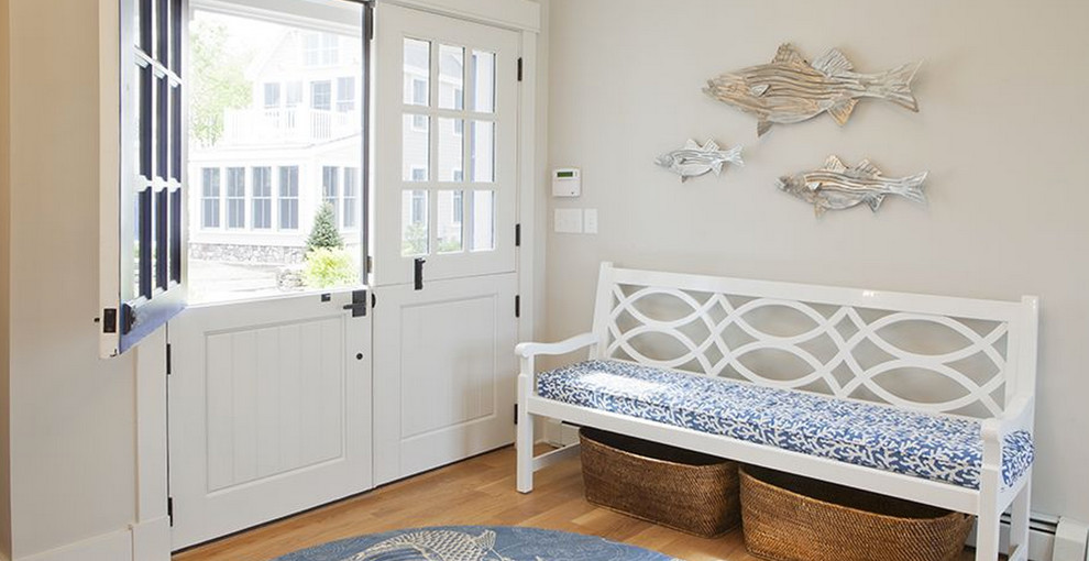 Inspiration for a mid-sized coastal light wood floor dutch front door remodel in Boston with beige walls and a blue front door