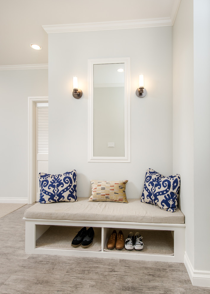 Small elegant porcelain tile entryway photo in Los Angeles with gray walls and a white front door