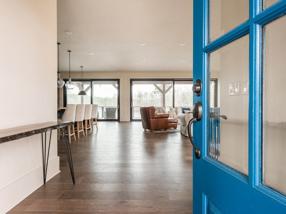 Design ideas for a medium sized modern front door in Atlanta with beige walls, medium hardwood flooring, a double front door and a blue front door.