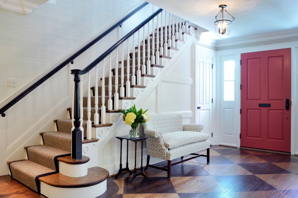 Traditional foyer in DC Metro with a single front door and a red front door.