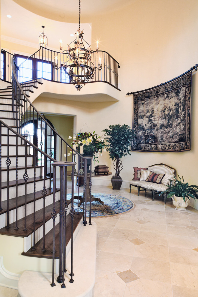 Inspiration for an expansive mediterranean foyer in San Francisco with beige walls and marble flooring.