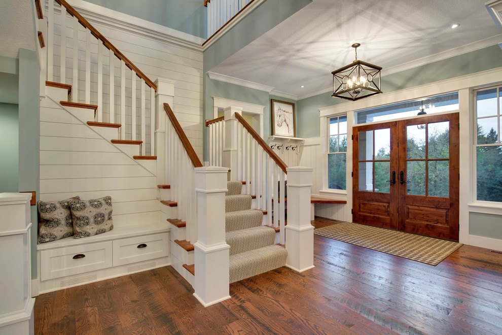 Inspiration for a farmhouse dark wood floor entryway remodel in Minneapolis with blue walls and a medium wood front door