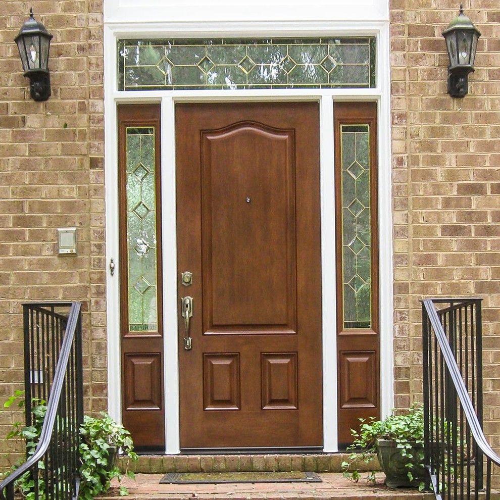 Design ideas for a large contemporary front door in Raleigh with beige walls, brick flooring, a single front door and a medium wood front door.