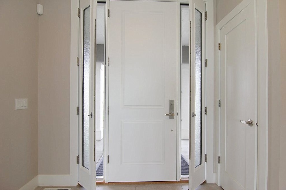 Single front door - mid-sized transitional ceramic tile single front door idea in Other with beige walls and a white front door