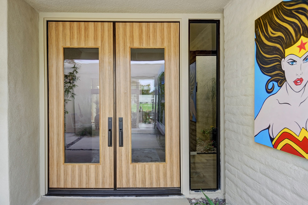 Medium sized contemporary front door in Other with a double front door, a medium wood front door and beige floors.