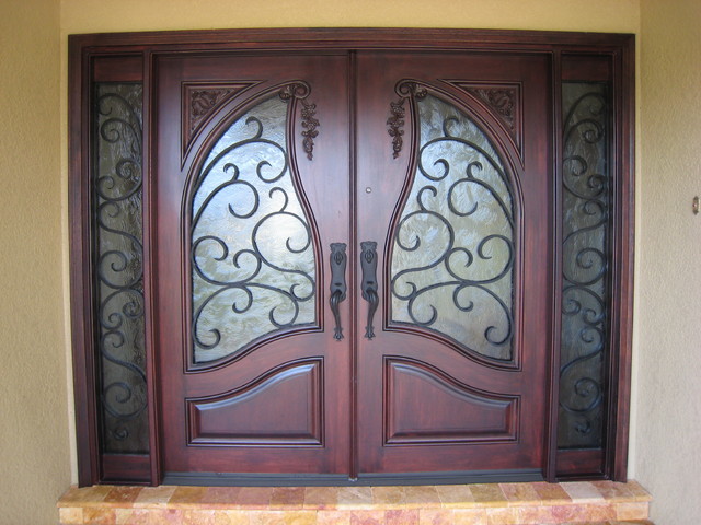 Inspiration for a medium sized bohemian front door in Tampa with beige walls, travertine flooring, a double front door and a dark wood front door.