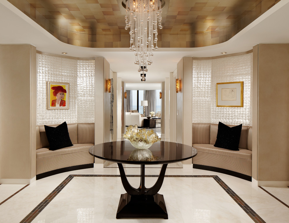 Example of a trendy foyer design in Miami with beige walls