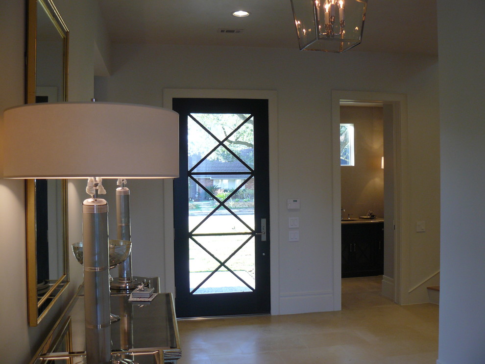 На фото: узкая прихожая среднего размера в современном стиле с белыми стенами, полом из керамической плитки, одностворчатой входной дверью и входной дверью из темного дерева