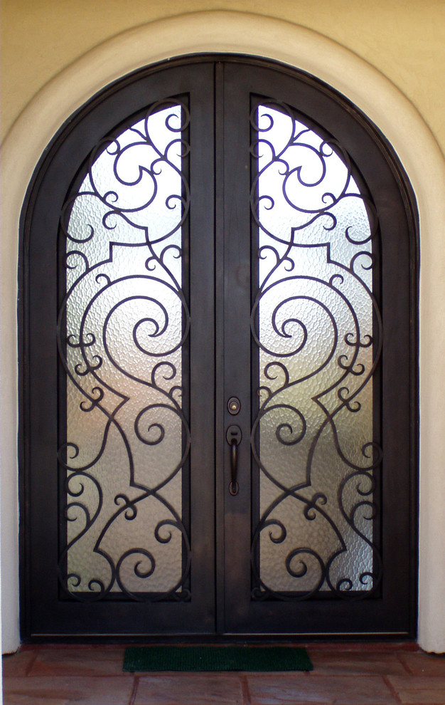 Entry Iron Door with Cantera Molding Traditional Entry Austin