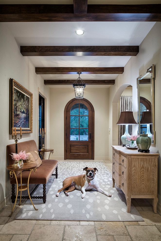 Inspiration for a timeless entryway remodel in Austin with beige walls and a dark wood front door