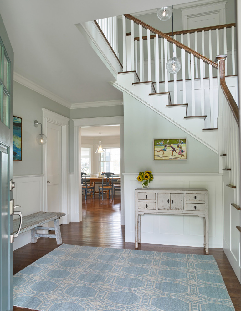 Design ideas for a nautical foyer in Portland Maine with grey walls, dark hardwood flooring, a single front door, a blue front door, brown floors and wainscoting.