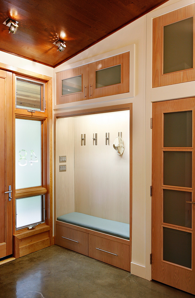 Photo of a beach style boot room in Toronto with white walls and a single front door.