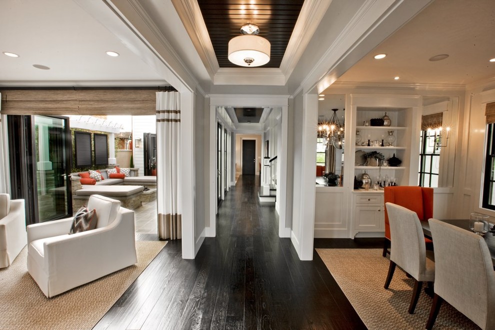 Photo of a classic entrance in Orange County with black floors.