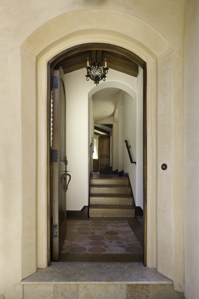 Inspiration for a mediterranean entryway remodel in Other with beige walls