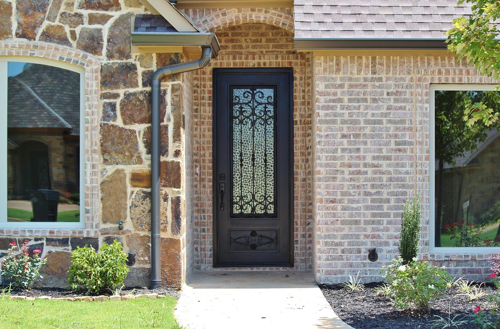 Traditional front door in Dallas with a single front door and a metal front door.