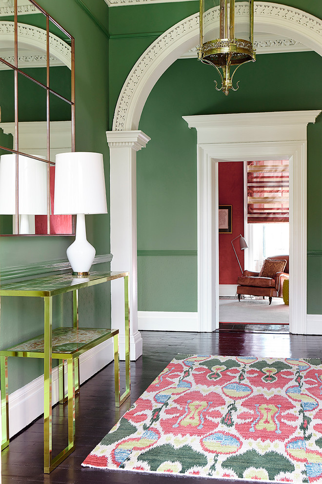 Foyer - transitional dark wood floor foyer idea in Dublin with green walls