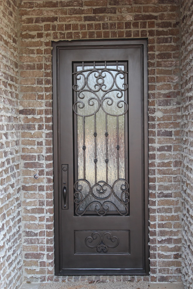 This is an example of a traditional front door in Dallas with a single front door and a metal front door.