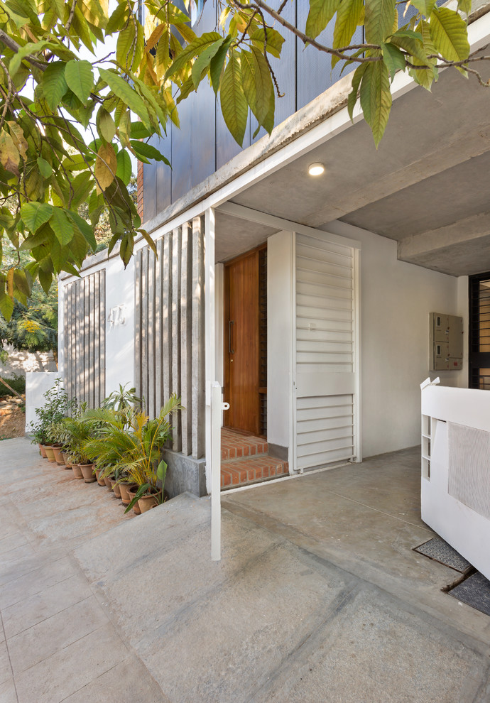 Inspiration for a contemporary entryway remodel in Bengaluru