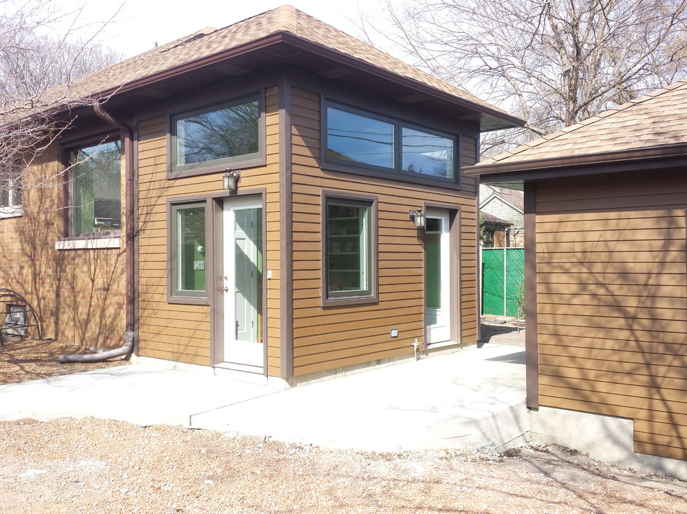 Inspiration for a small contemporary entryway remodel in Chicago with a glass front door