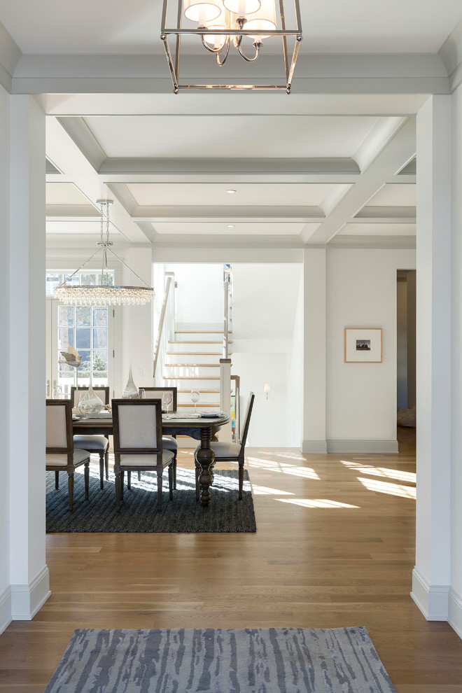 Inspiration for a nautical foyer in Minneapolis with white walls and light hardwood flooring.